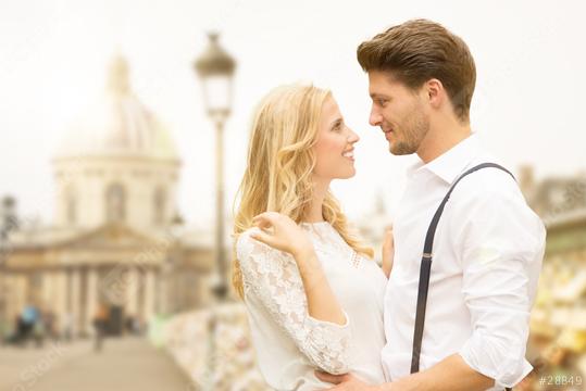 A romantic couple shares a loving gaze on a charming city street with a classic European backdrop, capturing a moment of love, connection, and timeless elegance in an urban setting  : Stock Photo or Stock Video Download rcfotostock photos, images and assets rcfotostock | RC Photo Stock.: