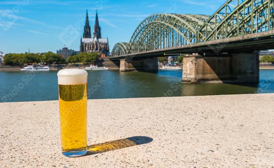 A Tra­di­tio­nal beer (Kölsch) at Cologne with cathedral and hohenzollern bridge  : Stock Photo or Stock Video Download rcfotostock photos, images and assets rcfotostock | RC Photo Stock.: