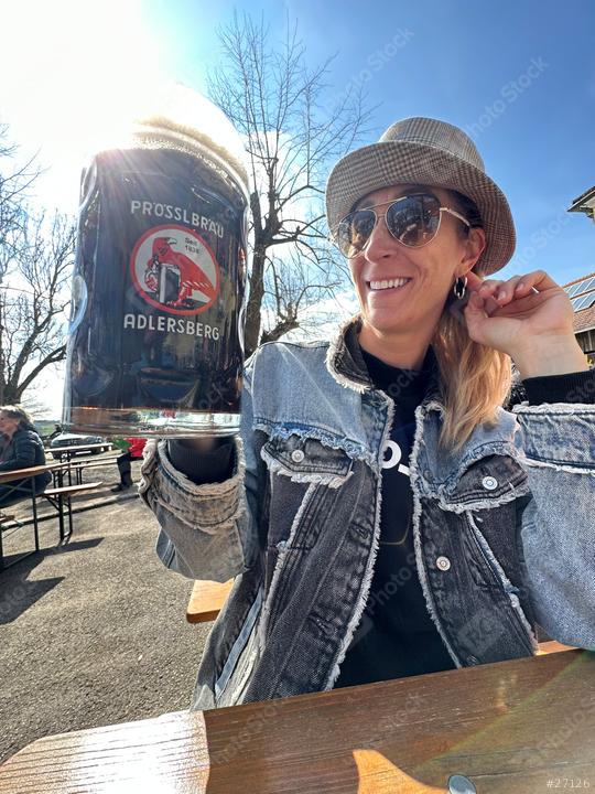 A woman in sunglasses and a hat holds up a large beer mug outdoors, smiling against a bright blue sky with bare trees in the background.
  : Stock Photo or Stock Video Download rcfotostock photos, images and assets rcfotostock | RC Photo Stock.: