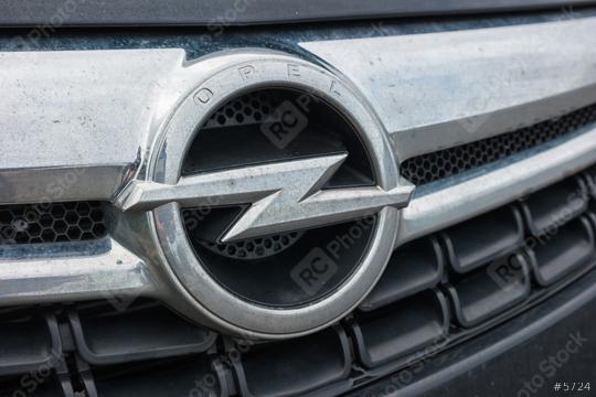 AACHEN, GERMANY FEBRUARY, 2017: Dirty Opel logo on a car grilll. Opel AG is a German automobile manufacturer.  : Stock Photo or Stock Video Download rcfotostock photos, images and assets rcfotostock | RC Photo Stock.: