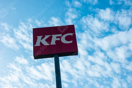 AACHEN, GERMANY FEBRUARY, 2017: Kentucky Fried Chicken Restaurant Logo with cloudy sky. It is a fast food restaurant chain headquartered in United States specialized in chicken products.  : Stock Photo or Stock Video Download rcfotostock photos, images and assets rcfotostock | RC Photo Stock.: