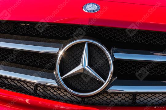 AACHEN, GERMANY FEBRUARY, 2017: Mercedes Benz logo on a red car grill. Mercedes-Benz is a German automobile manufacturer. The brand is used for luxury automobiles, buses, coaches and trucks.  : Stock Photo or Stock Video Download rcfotostock photos, images and assets rcfotostock | RC Photo Stock.: