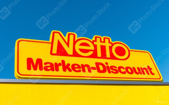 AACHEN, GERMANY FEBRUARY, 2017: Netto discount store Logo against blue sky. It is part of Edeka Group, largest German supermarket corporation employing 250,000 people.  : Stock Photo or Stock Video Download rcfotostock photos, images and assets rcfotostock | RC Photo Stock.: