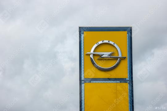AACHEN, GERMANY FEBRUARY, 2017: Opel official dealership logo over cloudy Sky. Opel AG is a German automobile manufacturer.  : Stock Photo or Stock Video Download rcfotostock photos, images and assets rcfotostock | RC Photo Stock.: