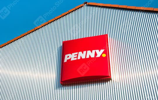 AACHEN, GERMANY FEBRUARY, 2017: Penny sign. Penny is, a discount supermarket chain based in Germany, which operates 3,550 stores in Europe. Penny market is owned by the German Rewe Group.  : Stock Photo or Stock Video Download rcfotostock photos, images and assets rcfotostock | RC Photo Stock.: