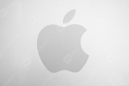 AACHEN, GERMANY FEBRUARY, 2017: White Apple logo on brushed aluminium background. Apple is the world