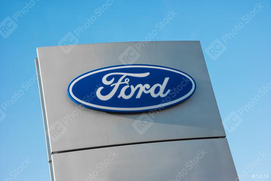 AACHEN, GERMANY JANUARY, 2017: Ford dealer sign against blue sky. The Ford Motor Company is an American multinational automaker founded by Henry Ford in 1903.  : Stock Photo or Stock Video Download rcfotostock photos, images and assets rcfotostock | RC Photo Stock.: