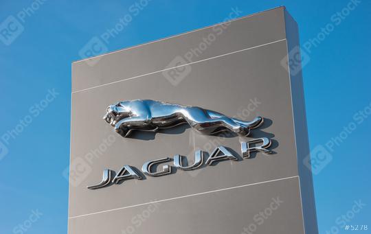 AACHEN, GERMANY JANUARY, 2017: Jaguar Logo against blue sky. Jaguar/Land Rover is a British multinational car manufacturer headquartered in Whitley, Coventry, England, owned byTata Motors since 2008.  : Stock Photo or Stock Video Download rcfotostock photos, images and assets rcfotostock | RC Photo Stock.: