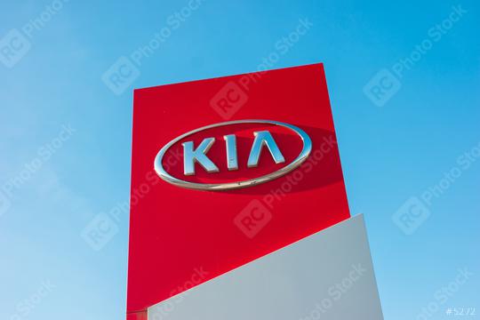 AACHEN, GERMANY JANUARY, 2017: Kia dealership sign against blue sky. Kia is South Korea