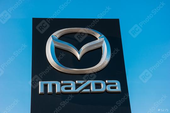 AACHEN, GERMANY JANUARY, 2017: Mazda dealership sign against blue sky. Mazda is a Japanese automaker and produces over 1 million vehicles per year.  : Stock Photo or Stock Video Download rcfotostock photos, images and assets rcfotostock | RC Photo Stock.: