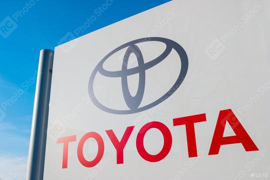 AACHEN, GERMANY JANUARY, 2017: Toyota dealership sign against blue sky. Toyota is the world