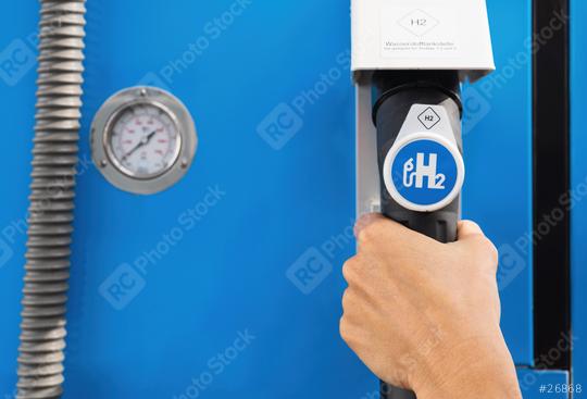 Aachen, Germany, January 2021: Female hold a fuel dispenser with hydrogen on gas station. h2 combustion engine for emission free eco friendly transport.  : Stock Photo or Stock Video Download rcfotostock photos, images and assets rcfotostock | RC Photo Stock.: