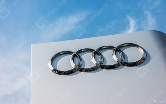 AACHEN, GERMANY MARCH, 2017: Audi dealership logo against blue sky. Audi is a German automobile manufacturer that designs, engineers, produces, markets and distributes luxury automobiles.  : Stock Photo or Stock Video Download rcfotostock photos, images and assets rcfotostock | RC Photo Stock.: