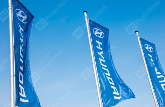 AACHEN, GERMANY MARCH, 2017: Hyundai flags against blue sky. Hyundai Motor Company is a South Korean multinational automotive manufacturer founded at 1967.  : Stock Photo or Stock Video Download rcfotostock photos, images and assets rcfotostock | RC Photo Stock.: