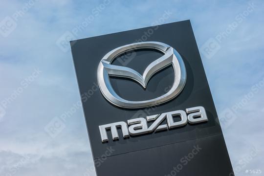 AACHEN, GERMANY MARCH, 2017: Mazda dealership sign against blue sky. Mazda is a Japanese automaker and produces over 1 million vehicles per year.  : Stock Photo or Stock Video Download rcfotostock photos, images and assets rcfotostock | RC Photo Stock.: