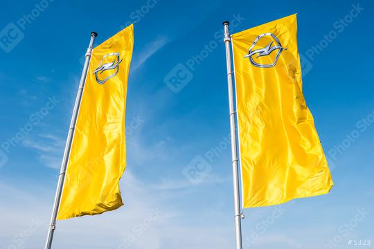 AACHEN, GERMANY MARCH, 2017: Opel flags against blue sky at the Opel Store. Opel AG is a German automobile manufacturer.  : Stock Photo or Stock Video Download rcfotostock photos, images and assets rcfotostock | RC Photo Stock.: