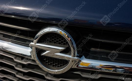 AACHEN, GERMANY MARCH, 2017: Opel logo on a dark blue car. Opel AG is a German automobile manufacturer.  : Stock Photo or Stock Video Download rcfotostock photos, images and assets rcfotostock | RC Photo Stock.: