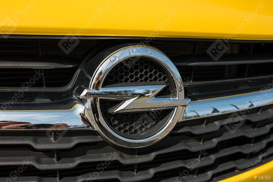 AACHEN, GERMANY MARCH, 2017: Opel logo on a yellow car. Opel AG is a German automobile manufacturer.  : Stock Photo or Stock Video Download rcfotostock photos, images and assets rcfotostock | RC Photo Stock.: