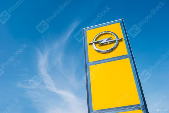 AACHEN, GERMANY MARCH, 2017: Opel official dealership logo over cloudy Sky. Opel AG is a German automobile manufacturer.  : Stock Photo or Stock Video Download rcfotostock photos, images and assets rcfotostock | RC Photo Stock.:
