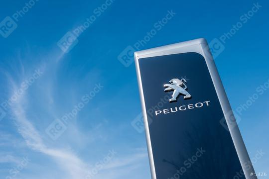 AACHEN, GERMANY MARCH, 2017: Peugeot dealership sign against blue sky. Peugeot is a French automobile manufacturer and part of Groupe PSA.  : Stock Photo or Stock Video Download rcfotostock photos, images and assets rcfotostock | RC-Photo-Stock.: