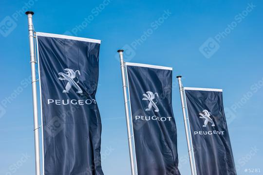 AACHEN, GERMANY MARCH, 2017: Peugeot flags against blue sky at the Peugeot Store. Peugeot is a French cars brand, part of PSA Peugeot Citroen.  : Stock Photo or Stock Video Download rcfotostock photos, images and assets rcfotostock | RC Photo Stock.: