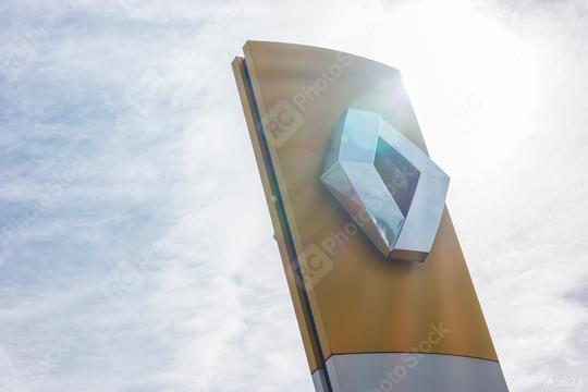 AACHEN, GERMANY MARCH, 2017: Renault dealership sign against cloudy sky with sunlight. Renault S.A. is a French car manufacturer producing cars, vans, buses, trucks, tractors, tanks, autorail vehicles  : Stock Photo or Stock Video Download rcfotostock photos, images and assets rcfotostock | RC Photo Stock.: