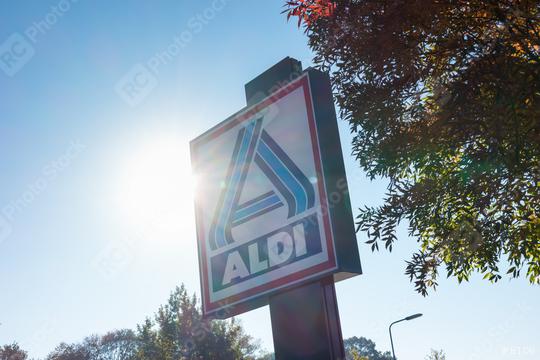 AACHEN, GERMANY OCTOBER, 2017: Aldi sign (north division) against blue sky with sunlight. Aldi is a leading global discount supermarket chain with almost 10,000 stores in 18 countries.  : Stock Photo or Stock Video Download rcfotostock photos, images and assets rcfotostock | RC Photo Stock.: