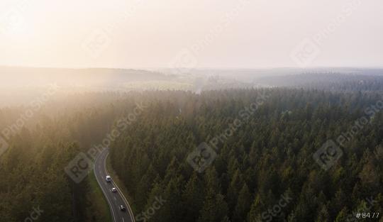 Aerial view of a mountain road covered in fog within a green forrest as spotted from above with a drone (Germany, Europe)  : Stock Photo or Stock Video Download rcfotostock photos, images and assets rcfotostock | RC Photo Stock.: