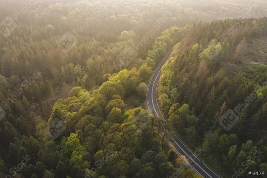 Aerial View of Road to the Mountains with mist, Top view of road through the trees shooting from drone  : Stock Photo or Stock Video Download rcfotostock photos, images and assets rcfotostock | RC Photo Stock.:
