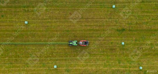 Aerial view of Tractor mowing green field in summer. Drone Shot  : Stock Photo or Stock Video Download rcfotostock photos, images and assets rcfotostock | RC Photo Stock.: