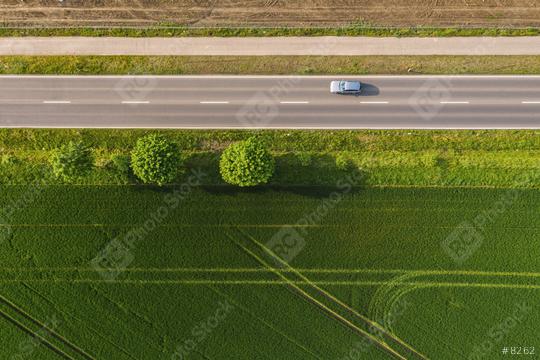 Aerial view of two lane road through countryside and cultivated fields with cars. Drone shot and copy space for text  : Stock Photo or Stock Video Download rcfotostock photos, images and assets rcfotostock | RC Photo Stock.:
