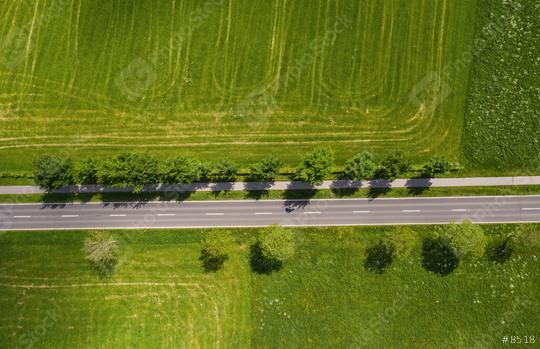Aerial view of two lane road through countryside and cultivated fields. Drone shot and copy space for text  : Stock Photo or Stock Video Download rcfotostock photos, images and assets rcfotostock | RC Photo Stock.: