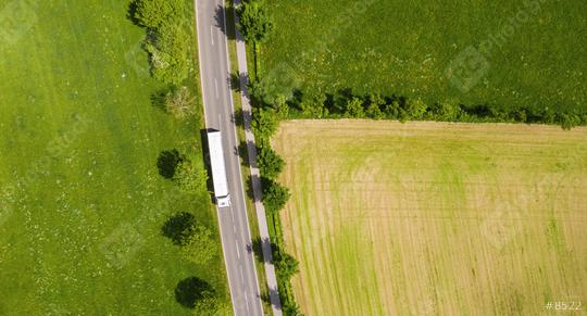 Aerial view of two lane road through countryside and cultivated fields with white truck. Drone shot and copy space for text  : Stock Photo or Stock Video Download rcfotostock photos, images and assets rcfotostock | RC Photo Stock.: