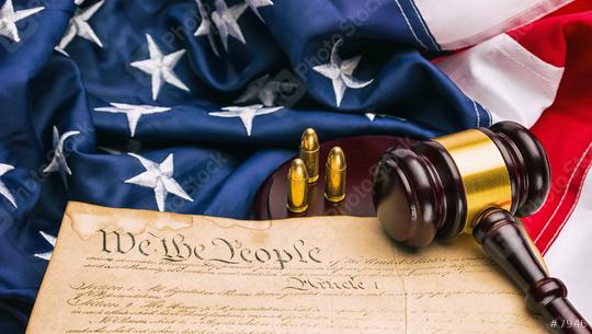 American Constitution with judge gavel and gun cartridges on a america flag  : Stock Photo or Stock Video Download rcfotostock photos, images and assets rcfotostock | RC-Photo-Stock.: