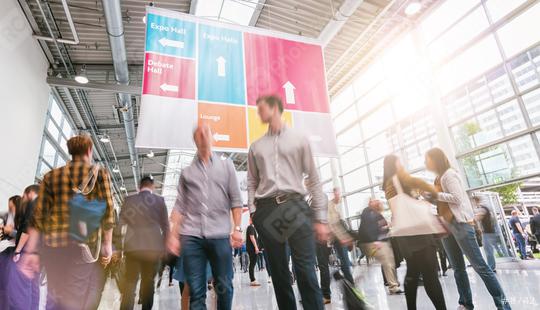 Anonymous Blurred businesspeople rushing at a trade fair  : Stock Photo or Stock Video Download rcfotostock photos, images and assets rcfotostock | RC Photo Stock.: