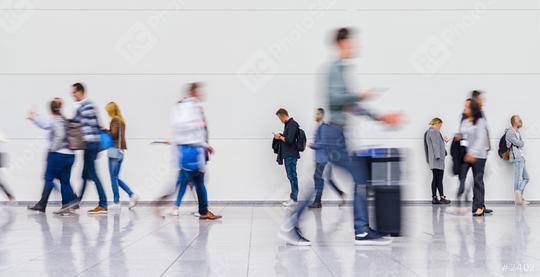 Anonymous blurred crowd of business people walks by gear on a trade fair or in an airport  : Stock Photo or Stock Video Download rcfotostock photos, images and assets rcfotostock | RC Photo Stock.:
