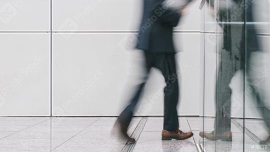 anonymous businessman walking in a corridor  : Stock Photo or Stock Video Download rcfotostock photos, images and assets rcfotostock | RC Photo Stock.: