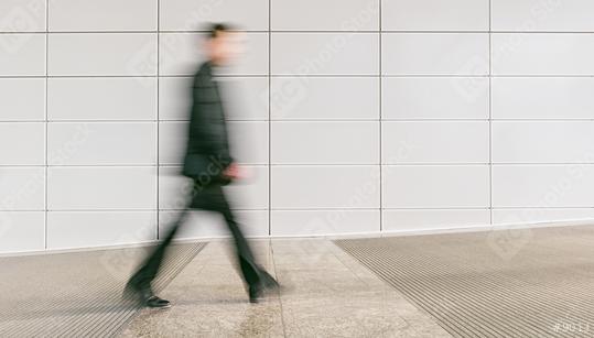 anonymous businessman walking in a floor, including copy space  : Stock Photo or Stock Video Download rcfotostock photos, images and assets rcfotostock | RC Photo Stock.:
