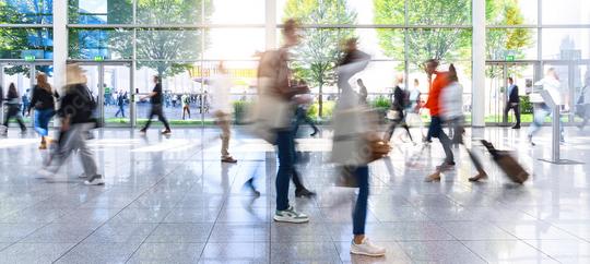 Anonymous crowd of business people go by gear on a trade fair  : Stock Photo or Stock Video Download rcfotostock photos, images and assets rcfotostock | RC Photo Stock.: