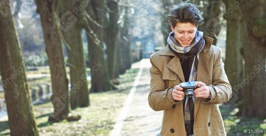 Attractive Tourist taking a photograph with vintage camera  : Stock Photo or Stock Video Download rcfotostock photos, images and assets rcfotostock | RC Photo Stock.: