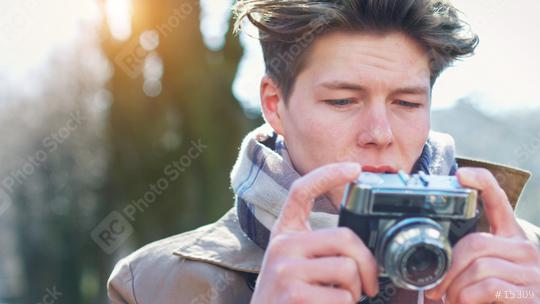 Attractive Tourist taking a photograph with vintage camera  : Stock Photo or Stock Video Download rcfotostock photos, images and assets rcfotostock | RC Photo Stock.: