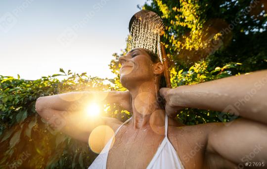 attractive woman enjoying relax shower after sauna in spa garden at sunset. Golden Hour Refreshment Hotel and wellness concept image  : Stock Photo or Stock Video Download rcfotostock photos, images and assets rcfotostock | RC Photo Stock.: