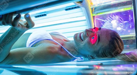 Attractive young woman tanning in solarium with glasses  : Stock Photo or Stock Video Download rcfotostock photos, images and assets rcfotostock | RC Photo Stock.: