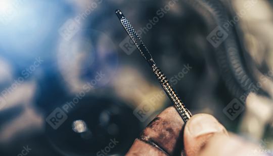 Auto mechanic check the oil in modern car motor in mechanics garage. Repair service. authentic close-up shot  : Stock Photo or Stock Video Download rcfotostock photos, images and assets rcfotostock | RC Photo Stock.: