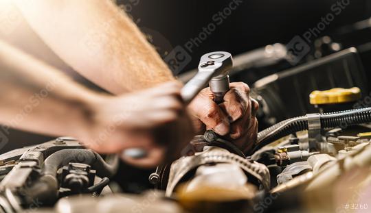 Auto mechanic in car repair service with wrench   : Stock Photo or Stock Video Download rcfotostock photos, images and assets rcfotostock | RC Photo Stock.: