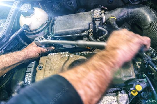 Auto mechanic working on car engine in a mechanics garage. Repair service. authentic close-up shot with motion blur  : Stock Photo or Stock Video Download rcfotostock photos, images and assets rcfotostock | RC Photo Stock.: