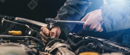 Auto mechanic working on car engine in mechanics garage. Repair service. authentic close-up shot, banner size  : Stock Photo or Stock Video Download rcfotostock photos, images and assets rcfotostock | RC Photo Stock.: