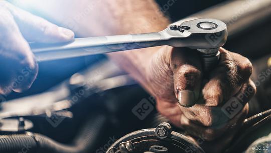 Auto mechanic working on car engine in mechanics garage. Repair service. authentic close-up shot  : Stock Photo or Stock Video Download rcfotostock photos, images and assets rcfotostock | RC Photo Stock.: