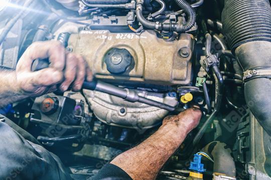Auto mechanic working on car engine in mechanics garage. Repair service. authentic close-up shot  : Stock Photo or Stock Video Download rcfotostock photos, images and assets rcfotostock | RC Photo Stock.: