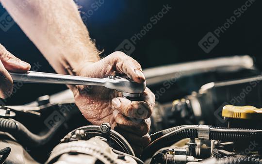 Auto mechanic working on car engine in mechanics garage. Repair service  : Stock Photo or Stock Video Download rcfotostock photos, images and assets rcfotostock | RC Photo Stock.: